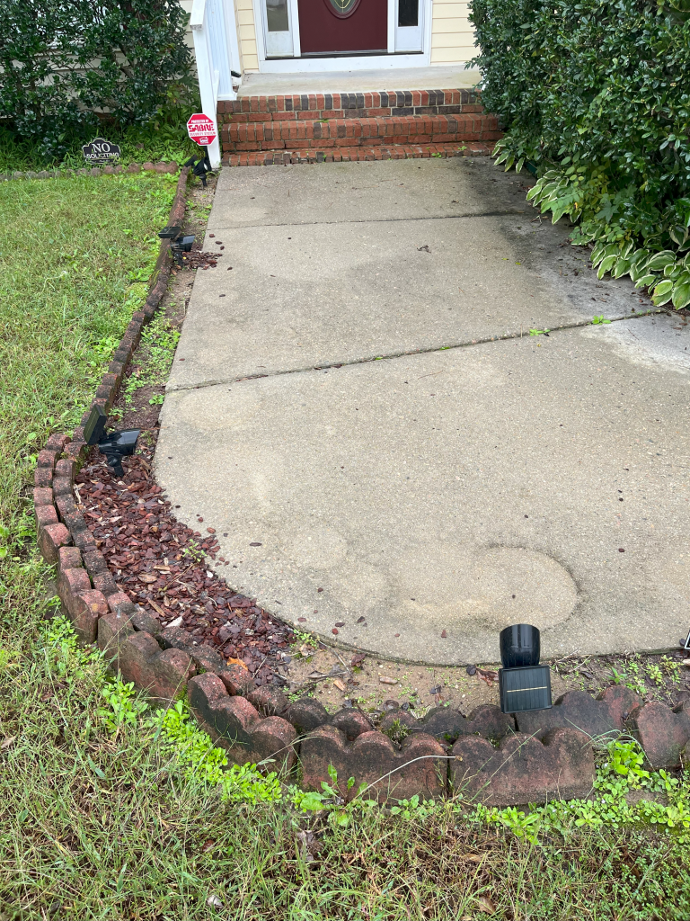 Dirty sidewalk before pressure washing